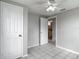 Bedroom with two doors, a ceiling fan and tile flooring at 3407 N 48Th St, Tampa, FL 33605