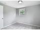 A cozy room with tile flooring and a bright window at 3407 N 48Th St, Tampa, FL 33605