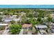 Charming single-story home featuring a well-kept lawn and driveway, surrounded by lush trees and greenery at 3407 N 48Th St, Tampa, FL 33605