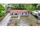 Aerial view of a charming one-story home with a well-maintained yard, showcasing its curb appeal at 3407 N 48Th St, Tampa, FL 33605