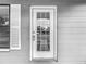 Close-up of the front door with a glass window and security features at 3407 N 48Th St, Tampa, FL 33605