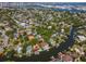 Striking aerial of waterfront real estate in upscale community, lush green landscaping, and private boat docks at 511 Erie Ave, Tampa, FL 33606