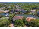 An aerial view of waterfront homes on a canal with docks and lush landscaping on a sunny day at 511 Erie Ave, Tampa, FL 33606
