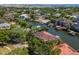 Aerial view of canal front homes with docks surrounded by lush green trees in a waterfront community at 511 Erie Ave, Tampa, FL 33606