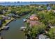 Waterfront homes with private docks in a canal community with lush landscaping on a sunny day at 511 Erie Ave, Tampa, FL 33606