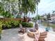 Waterfront property with a fire pit and dock, perfect for enjoying the outdoor scenery at 511 Erie Ave, Tampa, FL 33606
