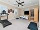 The exercise room includes a treadmill, sauna, a ceiling fan, and neutral colored walls at 511 Erie Ave, Tampa, FL 33606