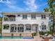 Rear exterior view of the house with a pool, balconies, and outdoor seating areas at 511 Erie Ave, Tampa, FL 33606
