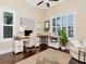 Bright office with ample natural light, wood floors, white trim, and custom desk and shelves at 511 Erie Ave, Tampa, FL 33606