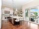 Bright kitchen features a spacious island with bar seating, stainless steel appliances, and outdoor access at 511 Erie Ave, Tampa, FL 33606