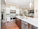 Beautiful kitchen with a center island, modern appliances, and seamless flow to the dining area at 511 Erie Ave, Tampa, FL 33606