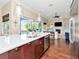 Spacious kitchen featuring an island, seamlessly connected to the living room and outdoor area at 511 Erie Ave, Tampa, FL 33606