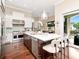 Well-equipped kitchen features a large island, stainless steel appliances, and backyard views at 511 Erie Ave, Tampa, FL 33606