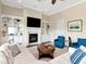 Inviting living room with a fireplace, built-in shelves, and comfortable seating at 511 Erie Ave, Tampa, FL 33606