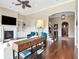 Inviting living room with fireplace, built-ins, hardwood floors, and open archway to foyer at 511 Erie Ave, Tampa, FL 33606