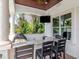 Stylish covered patio with an outdoor kitchen and bar, offering a perfect spot for entertaining and enjoying outdoor at 511 Erie Ave, Tampa, FL 33606