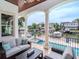 Relaxing covered patio with cozy seating and beautiful views of the waterfront and pool area at 511 Erie Ave, Tampa, FL 33606