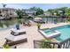 Waterfront property with a pool, spa, boat dock, and outdoor lounge area for relaxation and entertainment at 511 Erie Ave, Tampa, FL 33606