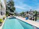 Gorgeous waterfront pool and spa area with beautiful landscaping and plenty of space for entertaining at 511 Erie Ave, Tampa, FL 33606