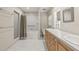 Neutral bathroom featuring double sinks, tub, and glass shower at 615 14Th Ne Ave, St Petersburg, FL 33701
