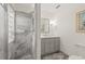 Modern bathroom featuring a stylish, glass-enclosed shower and elegant vanity with marble countertop at 615 14Th Ne Ave, St Petersburg, FL 33701
