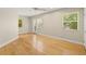 Bedroom featuring hardwood floors, multiple windows, and access to the backyard at 615 14Th Ne Ave, St Petersburg, FL 33701