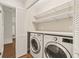 Convenient laundry room with washer, dryer, and shelving at 615 14Th Ne Ave, St Petersburg, FL 33701