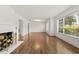 Bright living room with hardwood floors, white walls, and large windows at 615 14Th Ne Ave, St Petersburg, FL 33701