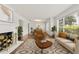 Bright living room with fireplace, hardwood floors, neutral furniture, and large windows at 615 14Th Ne Ave, St Petersburg, FL 33701