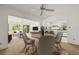 Open-concept living space with modern furnishings, a ceiling fan, and access to the outdoor patio at 615 14Th Ne Ave, St Petersburg, FL 33701