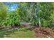 Serene backyard featuring a hammock strung between trees, creating a peaceful retreat at 7816 Citrus Blossom Dr, Land O Lakes, FL 34637