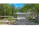 Charming single-story home with a well-manicured lawn and a two-car garage, offering great curb appeal at 7816 Citrus Blossom Dr, Land O Lakes, FL 34637