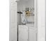 Functional laundry room with washer, dryer, and storage shelves at 7816 Citrus Blossom Dr, Land O Lakes, FL 34637