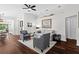 Bright living room with hardwood floors, stylish furniture, and modern decor at 7816 Citrus Blossom Dr, Land O Lakes, FL 34637