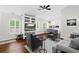 Inviting living room with hardwood floors, built-in shelving, and neutral decor, creating a cozy atmosphere at 7816 Citrus Blossom Dr, Land O Lakes, FL 34637