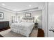 Serene main bedroom with tray ceiling, plantation shutters, and soft lighting, creating a relaxing retreat at 7816 Citrus Blossom Dr, Land O Lakes, FL 34637