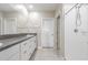Bathroom with double sink vanity, granite counters, white cabinetry, and a separate shower at 8749 Parsons Hill Blvd, Wesley Chapel, FL 33545
