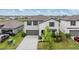 Charming two-story home featuring a well-manicured lawn and attached two-car garage at 8749 Parsons Hill Blvd, Wesley Chapel, FL 33545