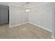 Bright dining room with tile floors and decorative chandelier at 9481 Highland Oak Dr # 703, Tampa, FL 33647