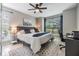 Cozy bedroom featuring a plush bed, natural light, and a calming color scheme for relaxation at 9481 Highland Oak Drive # 602, Tampa, FL 33647