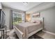 This bedroom offers neutral walls, a large window with view, and a comfortable queen bed at 9481 Highland Oak Drive # 602, Tampa, FL 33647