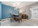 Inviting dining area with stylish lighting, seating for four, and a calming color scheme at 9481 Highland Oak Drive # 602, Tampa, FL 33647