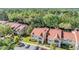 Lovely condo community showcasing vibrant landscaping and red tile roofing, nestled within the natural beauty of Florida at 9481 Highland Oak Drive # 602, Tampa, FL 33647