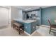 Well-equipped kitchen with modern island, stainless steel appliances, and stylish backsplash at 9481 Highland Oak Drive # 602, Tampa, FL 33647