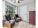 Relaxing living room with window views, seating, ceiling fan, and a neutral color palette at 9481 Highland Oak Drive # 602, Tampa, FL 33647