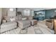 Stylish living room with open floorplan, and view of the updated kitchen with eat-in counter at 9481 Highland Oak Drive # 602, Tampa, FL 33647