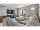 Open-concept living area featuring a large gray sectional and contemporary decor at 9481 Highland Oak Drive # 602, Tampa, FL 33647