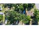 Lush trees surround this home with an in-ground pool, shed, and spacious backyard at 9616 Oak Ridge Ave, Riverview, FL 33578
