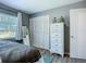 Cozy bedroom with ample natural light, closet, and neutral tones at 9616 Oak Ridge Ave, Riverview, FL 33578