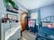 Bright bedroom featuring a well-organized desk area and closet for optimal space utilization at 9616 Oak Ridge Ave, Riverview, FL 33578